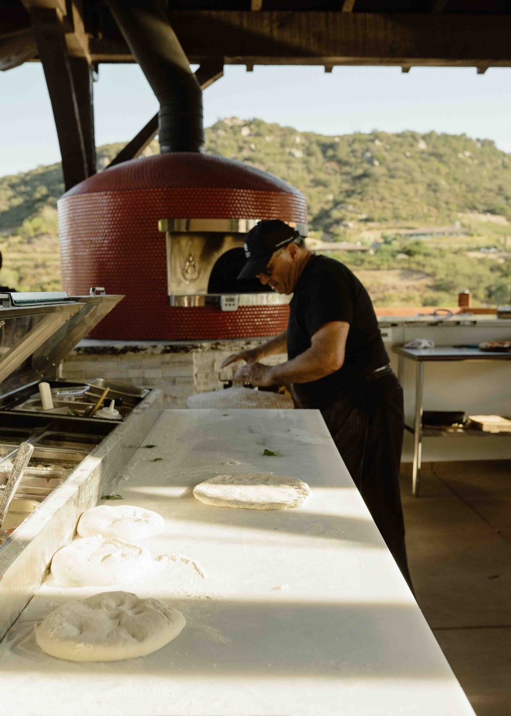 chef at pizza oven